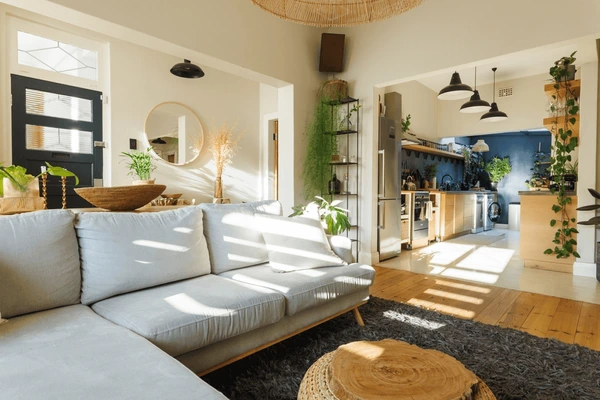 Living room with smart use of shelves, seating, and open space.